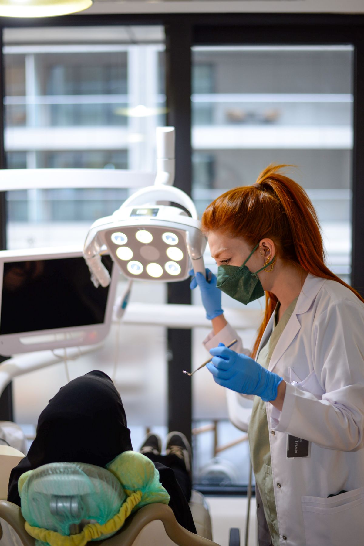Dentist treating a patient at Dar Al Khaybar Medical Center, Sharjah